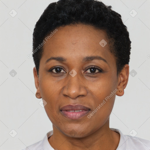 Joyful black adult female with short  black hair and brown eyes