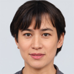 Joyful white adult female with short  brown hair and brown eyes