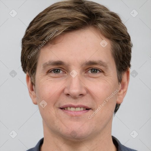 Joyful white adult male with short  brown hair and grey eyes