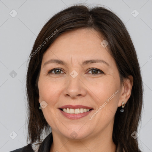 Joyful white adult female with medium  brown hair and brown eyes