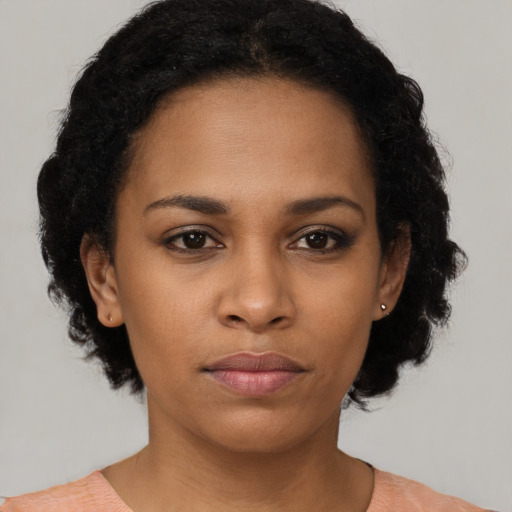 Neutral black young-adult female with short  black hair and brown eyes