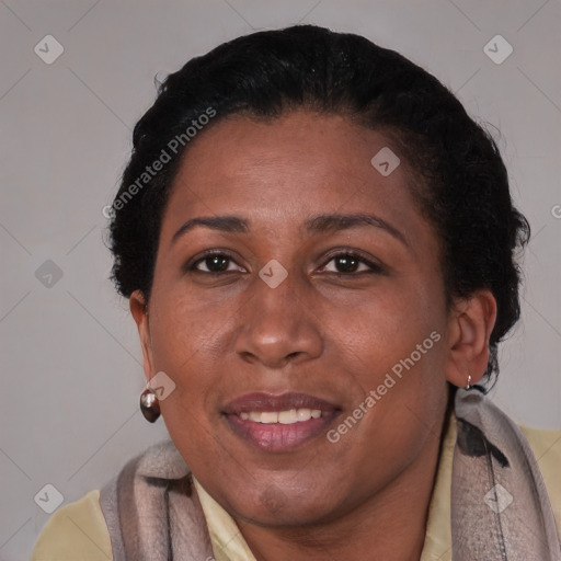 Joyful black adult female with short  brown hair and brown eyes