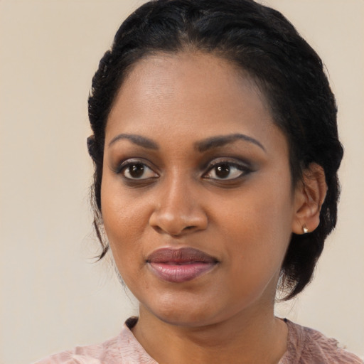 Joyful black young-adult female with medium  brown hair and brown eyes