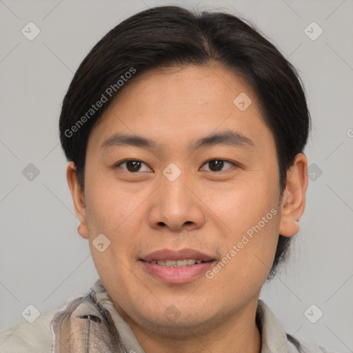 Joyful asian young-adult male with short  brown hair and brown eyes