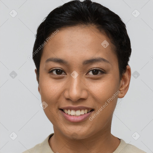 Joyful asian young-adult female with short  brown hair and brown eyes