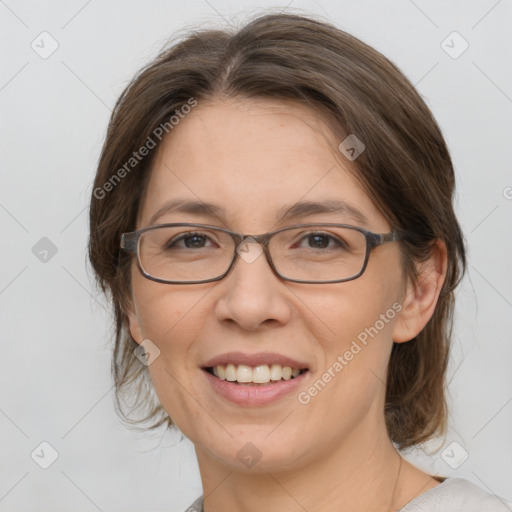 Joyful white adult female with medium  brown hair and grey eyes