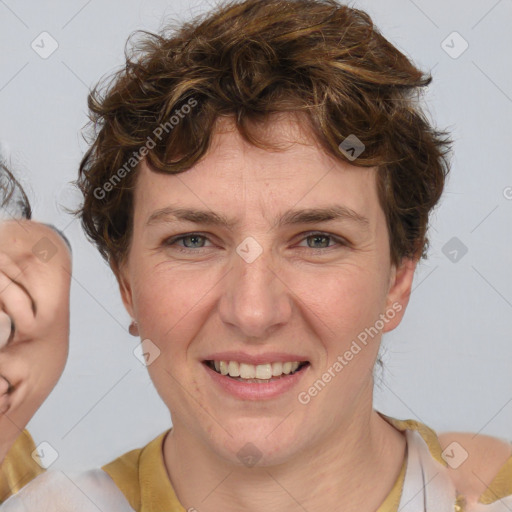 Joyful white adult female with medium  brown hair and blue eyes