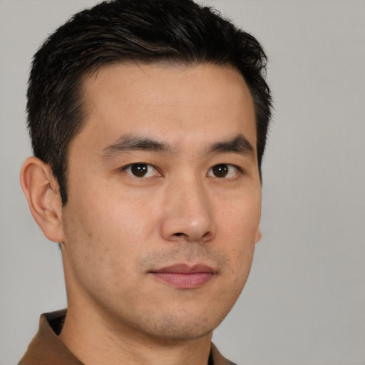 Neutral asian young-adult male with short  brown hair and brown eyes