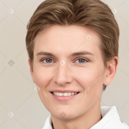 Joyful white young-adult female with short  brown hair and grey eyes