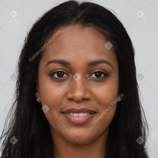 Joyful black young-adult female with long  brown hair and brown eyes