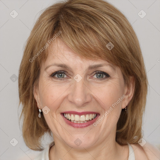 Joyful white adult female with medium  brown hair and grey eyes