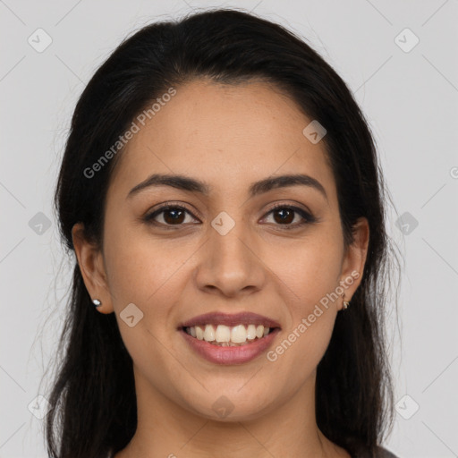 Joyful latino young-adult female with long  brown hair and brown eyes