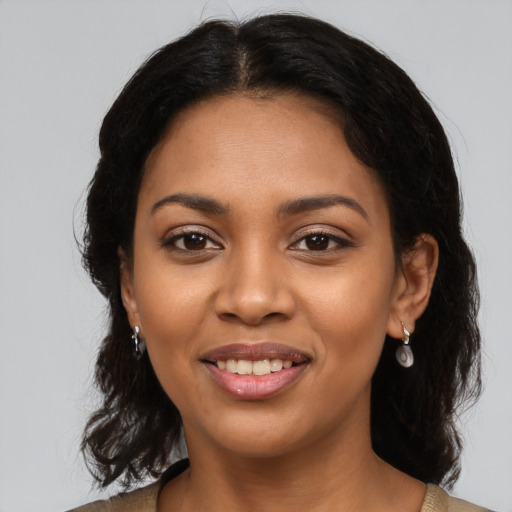 Joyful latino young-adult female with medium  brown hair and brown eyes
