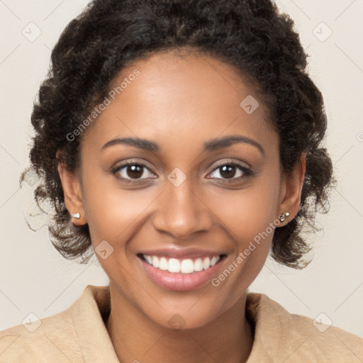 Joyful black young-adult female with long  brown hair and brown eyes