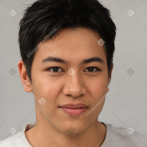 Joyful asian young-adult male with short  brown hair and brown eyes