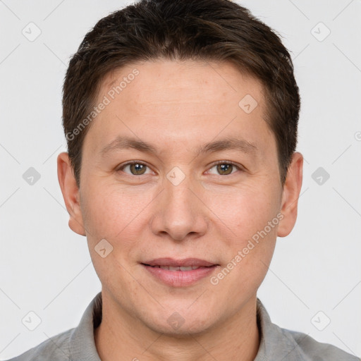 Joyful white adult male with short  brown hair and brown eyes