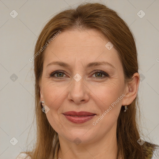 Joyful white adult female with long  brown hair and brown eyes