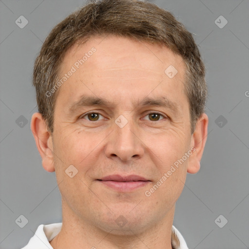 Joyful white adult male with short  brown hair and grey eyes