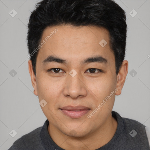 Joyful asian young-adult male with short  black hair and brown eyes