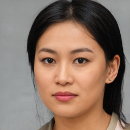 Joyful asian young-adult female with medium  black hair and brown eyes