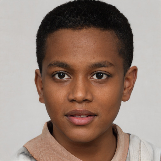 Joyful black child male with short  brown hair and brown eyes