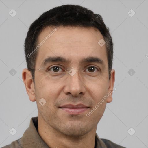 Joyful white adult male with short  brown hair and brown eyes