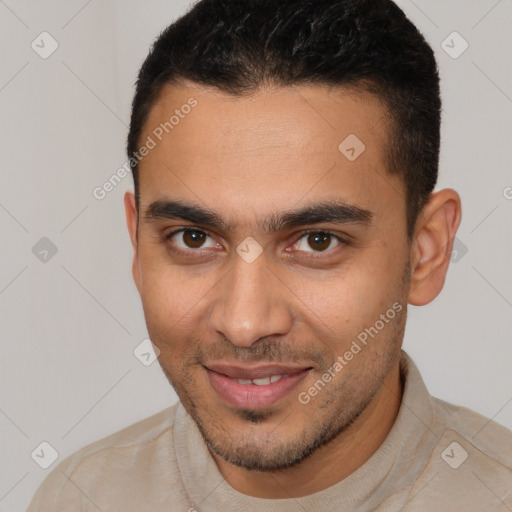 Joyful white young-adult male with short  brown hair and brown eyes