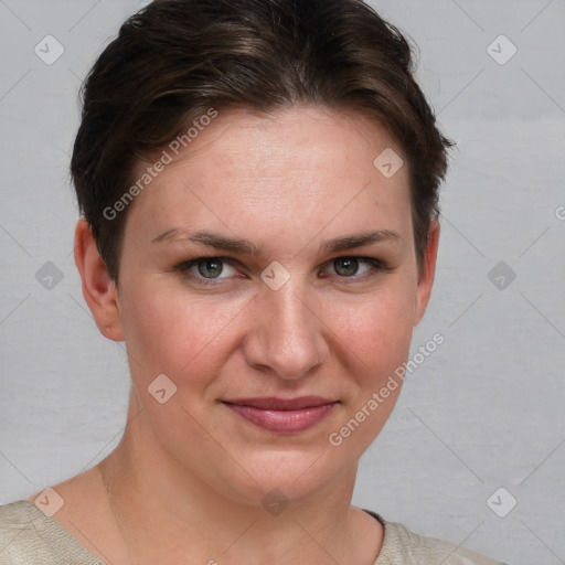 Joyful white young-adult female with short  brown hair and grey eyes