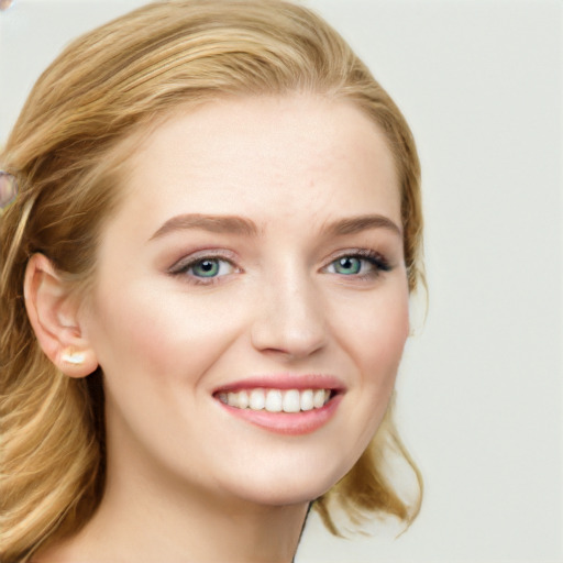 Joyful white young-adult female with long  brown hair and blue eyes