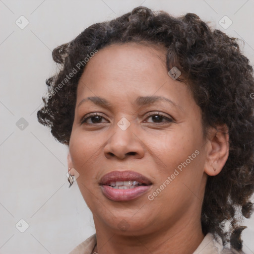 Joyful black adult female with medium  brown hair and brown eyes