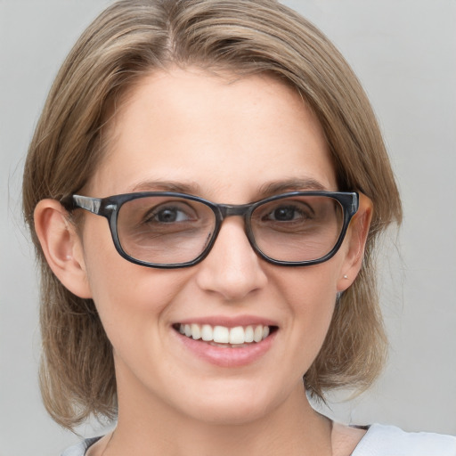 Joyful white young-adult female with medium  brown hair and blue eyes