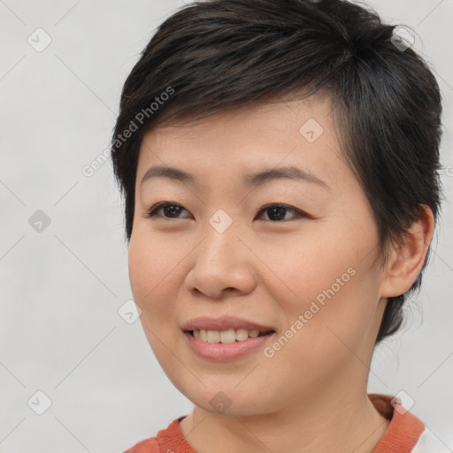 Joyful asian young-adult female with short  brown hair and brown eyes