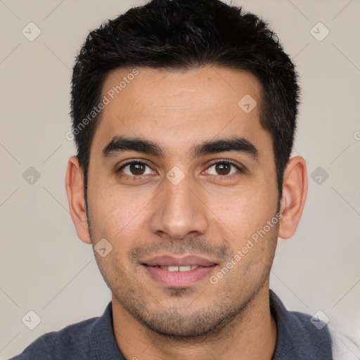 Joyful white young-adult male with short  black hair and brown eyes