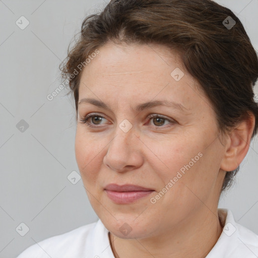 Joyful white adult female with short  brown hair and brown eyes