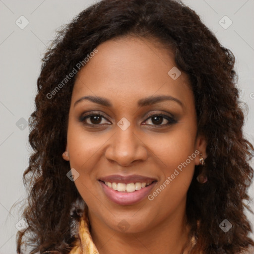 Joyful black young-adult female with long  brown hair and brown eyes