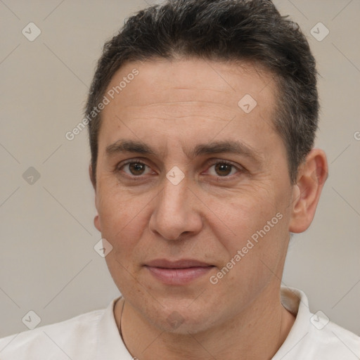 Joyful white adult male with short  brown hair and brown eyes