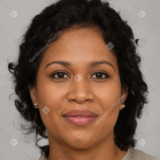 Joyful black adult female with medium  brown hair and brown eyes