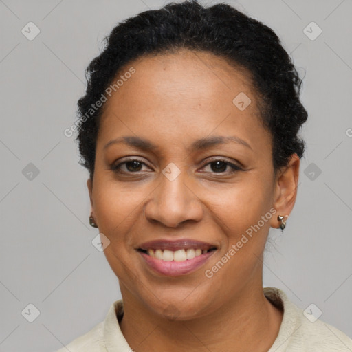 Joyful latino adult female with short  brown hair and brown eyes