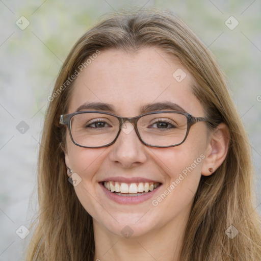 Joyful white adult female with long  brown hair and brown eyes