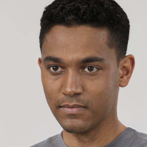 Neutral black young-adult male with short  black hair and brown eyes