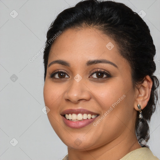 Joyful latino young-adult female with medium  brown hair and brown eyes