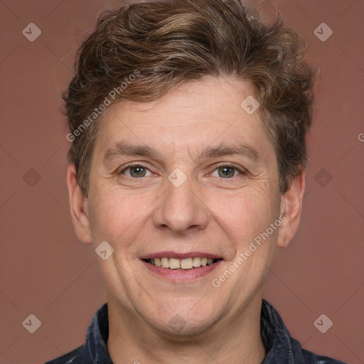 Joyful white adult male with short  brown hair and grey eyes