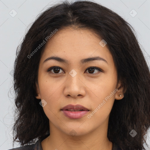 Joyful asian young-adult female with long  brown hair and brown eyes