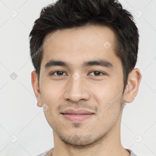 Joyful white young-adult male with short  black hair and brown eyes