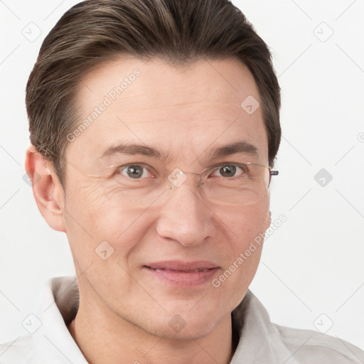 Joyful white adult male with short  brown hair and grey eyes