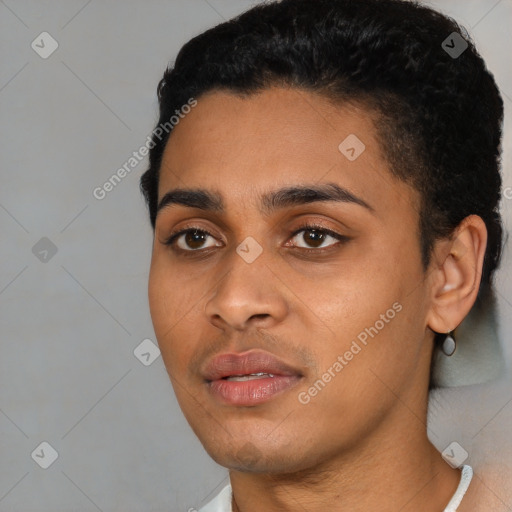 Joyful black young-adult male with short  black hair and brown eyes