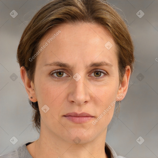 Joyful white adult female with medium  brown hair and grey eyes