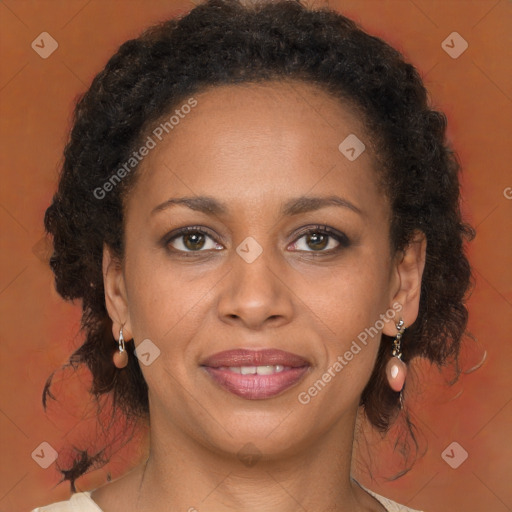 Joyful black adult female with medium  brown hair and brown eyes