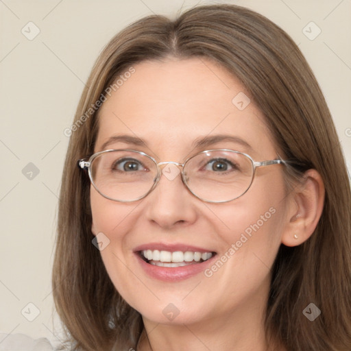 Joyful white adult female with long  brown hair and brown eyes