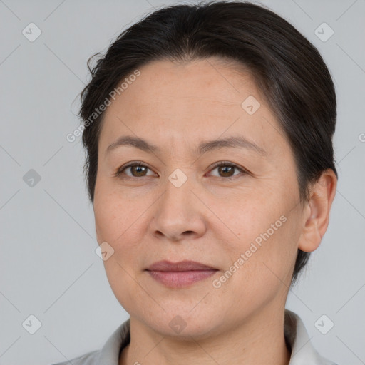 Joyful white adult female with short  brown hair and brown eyes